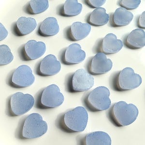 These mini Blue Chalcedony Heart cabochons are a pretty periwinkle blue