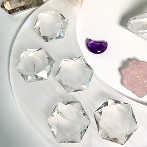 An array of Crystal Hexagons shown on a moon plate with some other crystals in the background
