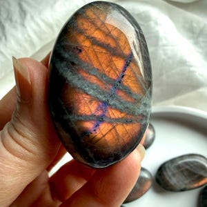 Peach Sunset Labradorite palm stone with orange flash and subtle violet undertones