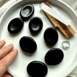 Black Obsidian thumb stones with Palo Santo + selenite – grounding crystals for meditation + energetic protection