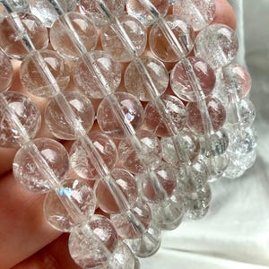 Clear Quartz bead bracelet with soft rainbow flashes for chakra healing and energetic cleansing