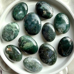 Moss agate palm stones with green dendritic inclusions, polished grounding crystals for calm, emotional balance, and meditation
