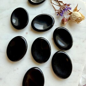 Group of 8 polished Black Obsidian worry stones – pocket-sized crystals for anxiety, grounding + spiritual balance