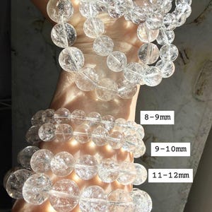 High clarity Clear Quartz bracelet stack shown bead sizes marked 8-14mm for comparison, and iridescent rainbow reflections