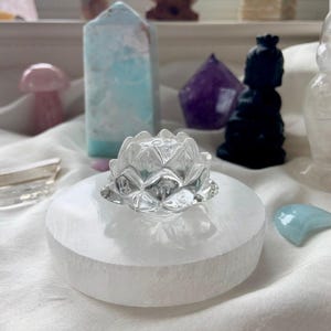 Clear Quartz crystal lotus flower displayed with Selenite and Amethyst for meditation and spiritual practice
