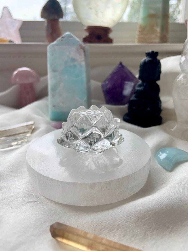 Clear Quartz crystal lotus flower displayed with Selenite and Amethyst for meditation and spiritual practice