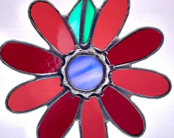 Stained glass flower featuring actual bicycle cog