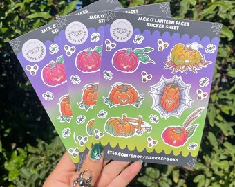 May include: A sticker sheet with a variety of jack-o'-lantern faces. The sheet is purple and green with a white border. The text "Jack O'Lantern Faces Sticker Sheet" is printed at the top of the sheet. The text "Etsy.com/shop/sierrrapooks" is printed at the bottom of the sheet.