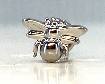 May include: A silver bee pin with detailed wings and a textured body. The bee is a popular symbol of hard work and community.