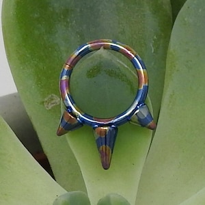 Titanium ASTM F136 Anodised Oil Slick &quot;Jazz&quot; Spiked Clicker 1.2mm (16ga) Suitable for Conch, Septum, Daith, Rook, Helix, Cartilage, Tragus