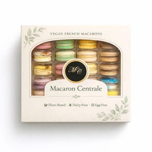 May include: A box of vegan French macarons in various colors, including pink, green, and yellow. The box is labeled "Macaron Centrale" and states the macarons are plant-based, dairy-free, and egg-free.