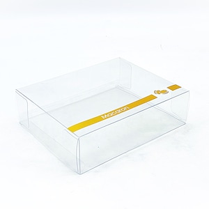 May include: Clear plastic box with a gold stripe and the word "Macaron" printed on it.