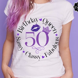 May include: White t-shirt with a purple glitter design that says "Birthday Queen 50 Sassy Classy Fabulous" with a crown, a heart, and a purple glitter lip print.