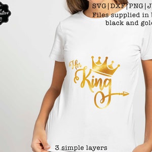 May include: A white t-shirt with a gold glitter design that says "Her King" with a crown and arrow. The design is layered and easy to cut.