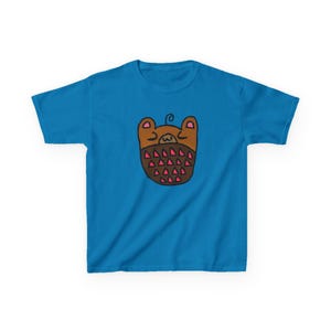 May include: A turquoise blue t-shirt featuring a whimsical cartoon bear design. The bear is brown with pink triangle accents and a small swirl above its head. The shirt is made of a soft material, perfect for casual wear.