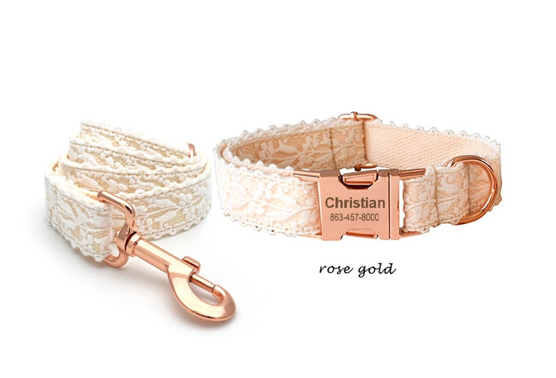 May include: White lace dog collar and lead set with rose gold hardware. The collar has a personalised name tag that reads "Christian 863-457-8000".