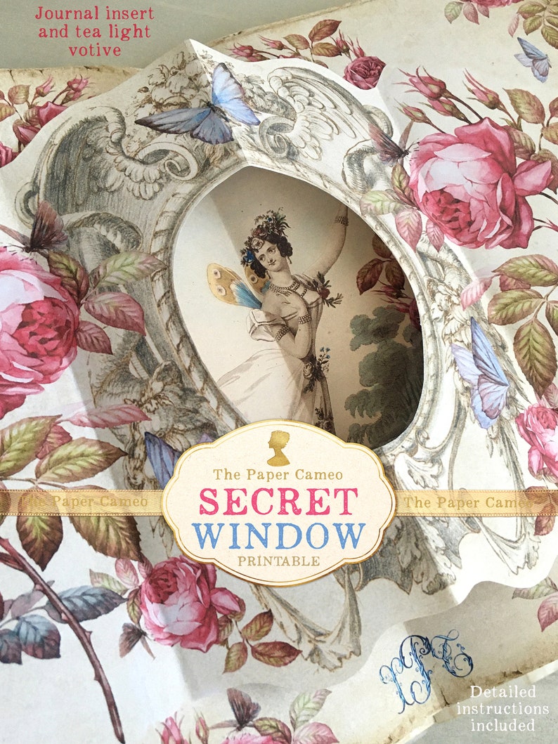 May include: A printable paper craft kit featuring a secret window with a fairy illustration. The window is surrounded by a floral design with butterflies and roses. The text "The Paper Cameo SECRET WINDOW PRINTABLE" is visible on the front of the kit.