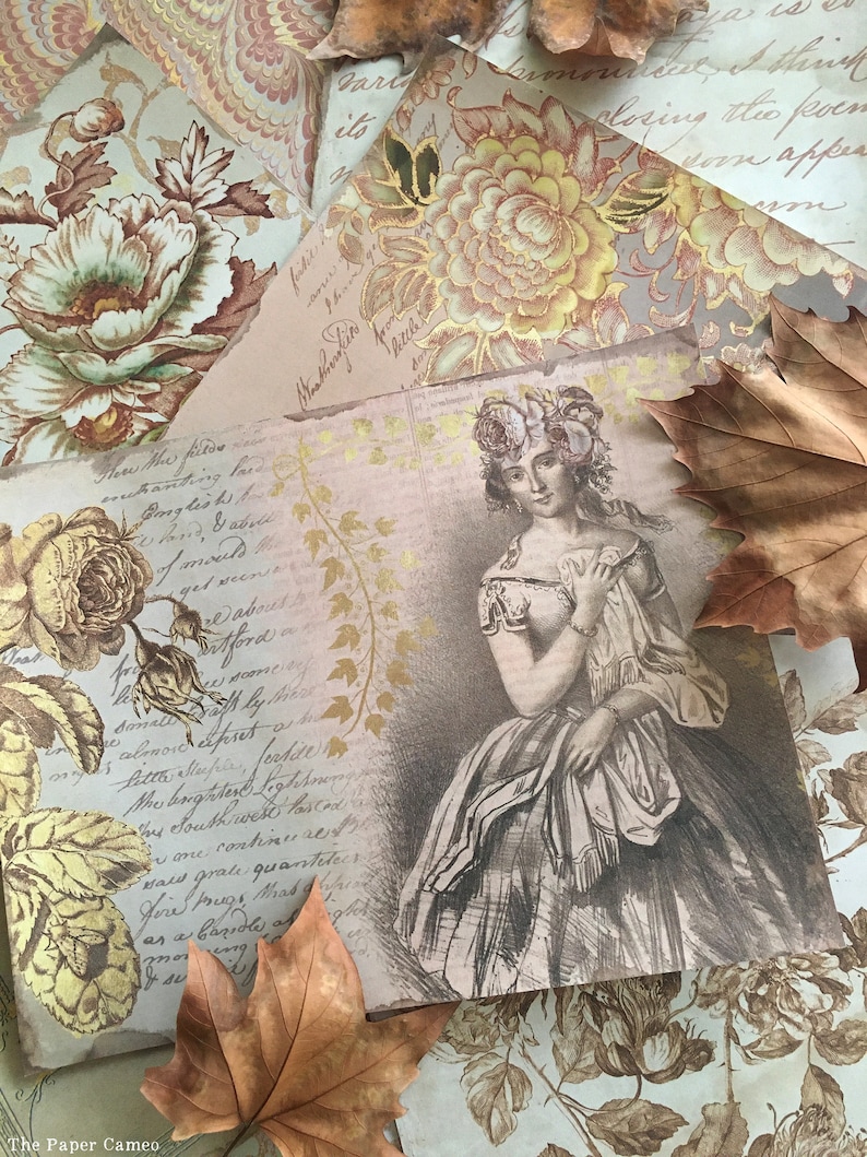 May include: A vintage style image of a woman in a dress with a floral crown. The image is printed on a paper background with handwritten text and floral patterns. The image is surrounded by autumn leaves.