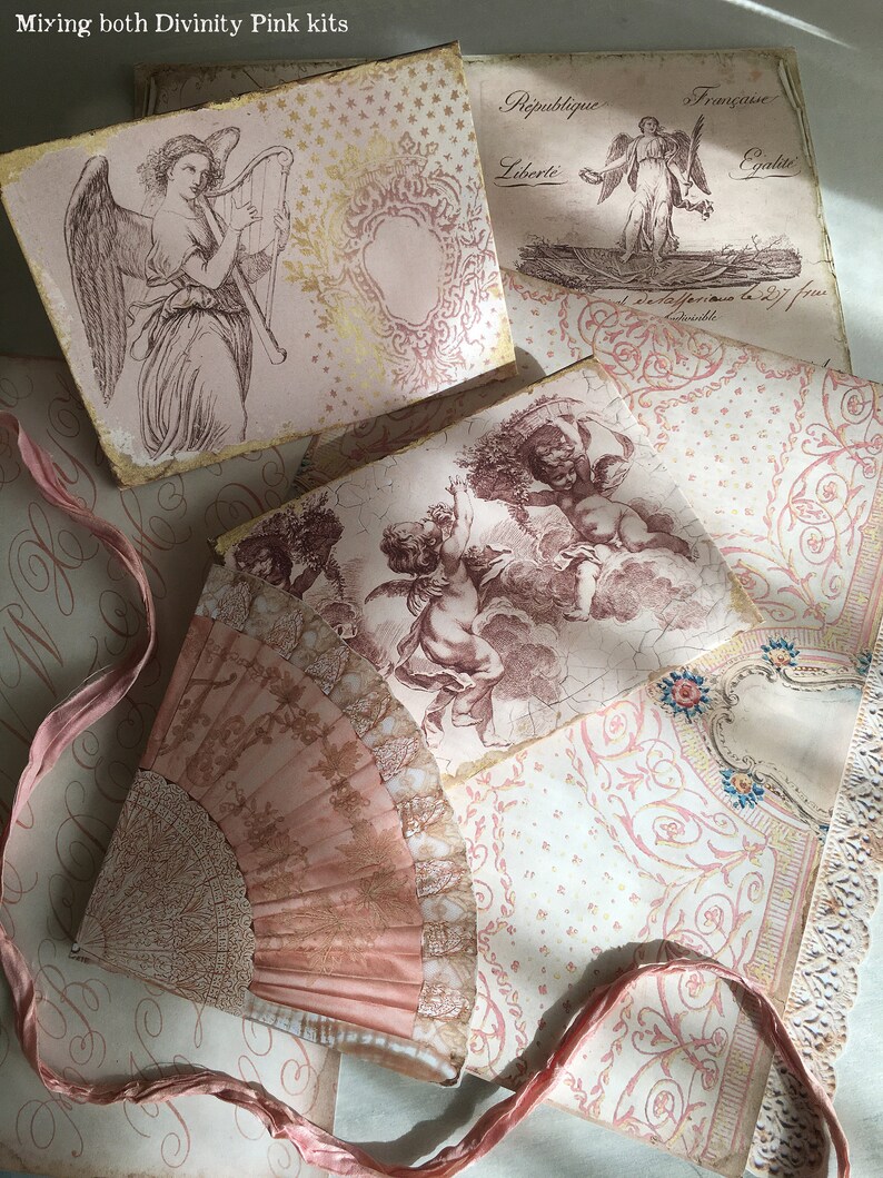 May include: A collection of vintage pink and gold paper ephemera with images of angels and cherubs. The paper is decorated with intricate patterns and designs. The paper is arranged in a layered fashion, creating a sense of depth and texture.