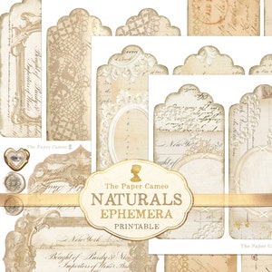 May include: A set of printable vintage-style ephemera tags with ornate borders and handwritten text. The tags feature a cream background with gold accents and are perfect for scrapbooking, card making, and other craft projects.