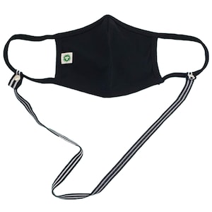 May include: Black face mask with a white and black striped lanyard. The mask has a small green logo on the front.