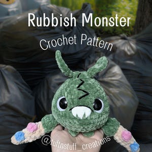 May include: A green plush monster toy with a textured surface, large black eyes, a white mouth with two teeth, and two long arms featuring pink and blue circular patches. The text Rubbish Monster Crochet Pattern and @tuftnstuff_creations are visible.
