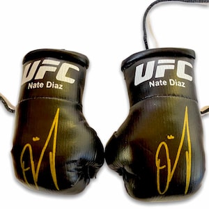 UFC Nate Diaz Autographed Mini Boxing Gloves.     pair of unique collector&#39;s edition Gloves
