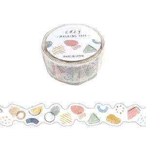 May include: A roll of washi tape with a white background and colorful abstract shapes. The tape is labeled "Cozy - Masking Tape - Made in Japan".