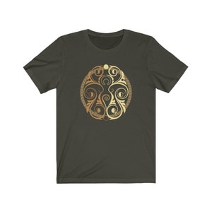May include: A dark green t-shirt with a gold and light gold circular design featuring intricate swirls and patterns.