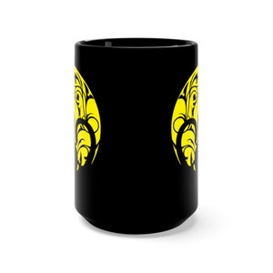 May include: Black ceramic mug with a yellow design of a stylised floral pattern on each side.