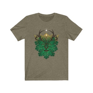 May include: A green and gold t-shirt with a stylized green man design. The green man has antlers and a leafy face.