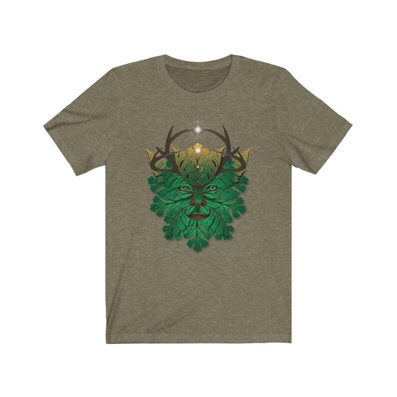 May include: A green and gold t-shirt with a stylized green man design. The green man has antlers and a leafy face.