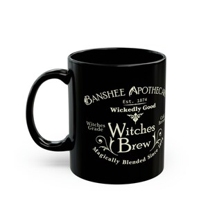 May include: Black ceramic mug with a white design that reads "Banshee Apothecary Est. 1874 Wickedly Good Witches Brew Magically Blended Since 1874"