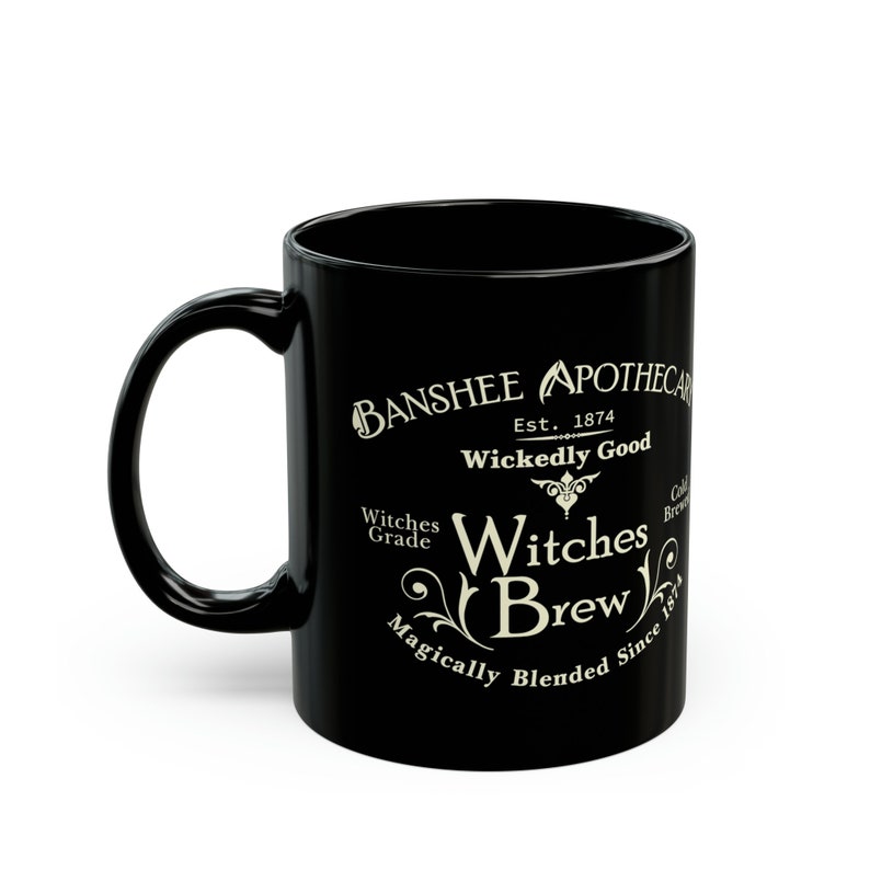 May include: Black ceramic mug with a white design that reads "Banshee Apothecary Est. 1874 Wickedly Good Witches Brew Magically Blended Since 1874"