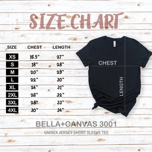 May include: Size chart for a unisex jersey short sleeve tee, showing chest and length measurements in inches for sizes XS to 4XL. The chart is on a woodgrain background with a black t-shirt displayed on top.