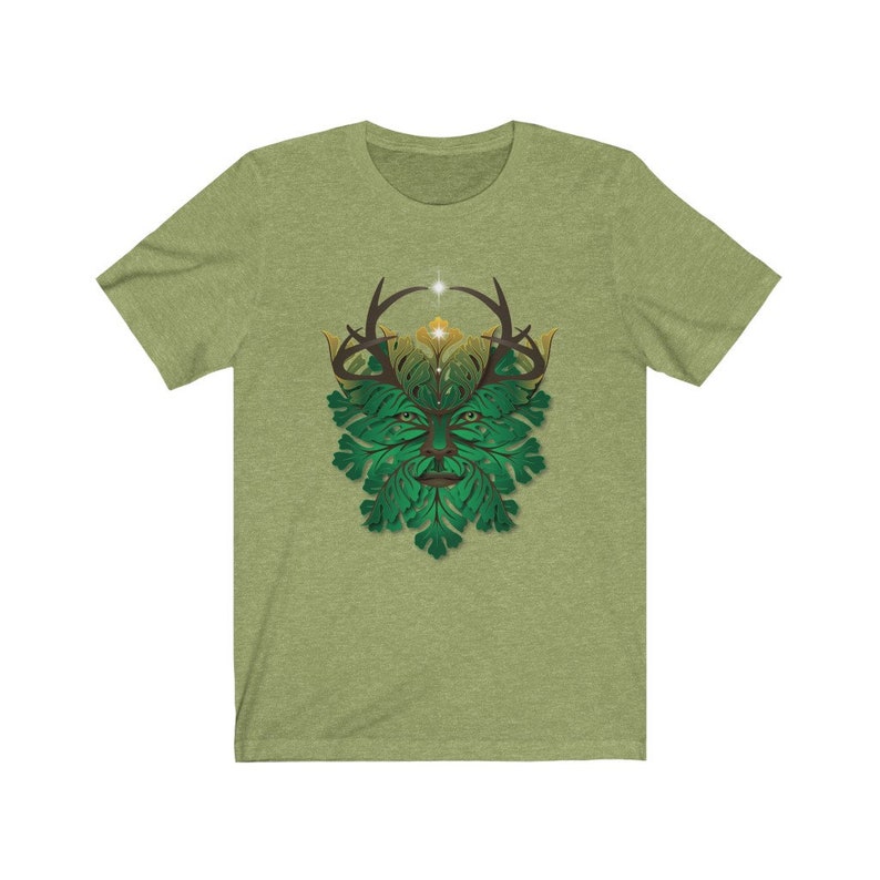 May include: A green and gold t-shirt with a graphic of the Green Man, a mythical figure with a face made of leaves and antlers.