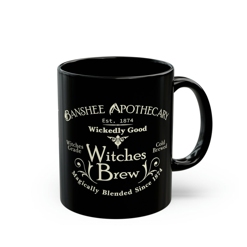 May include: Black ceramic mug with a white design that reads "Banshee Apothecary Est. 1874 Wickedly Good Witches Brew Magically Blended Since 1874"