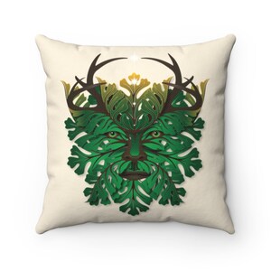 May include: A decorative pillow featuring a stylised image of the Green Man, a mythical figure associated with nature and the forest. The Green Man's face is surrounded by leaves and branches, and he has antlers on his head.