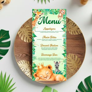 A menu featuring a giraffe and lion illustration is displayed on a wooden plate, surrounded by green leaves and stuffed animals.