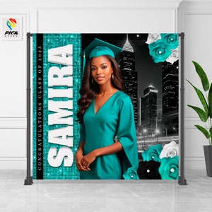 May include: A graduation backdrop featuring a black and white cityscape with a turquoise and white floral design. The backdrop also features the name "SAMIRA" and the text "CONGRATULATIONS CLASS OF 2025".