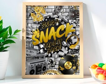 May include: A framed print with a retro theme. The artwork features a black and gold design with the words "Snag a Snack Take it Back!" against a brick wall background. Gold accents include a dollar sign, headphones, and a record.