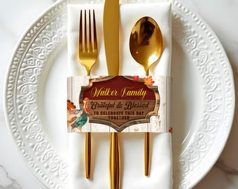 May include: A Thanksgiving-themed cutlery holder with a rustic wood background and a red sign that reads "Walker Family Grateful & Blessed To Celebrate This Day Together". The holder features a turkey illustration and fall leaves.