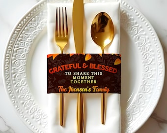 May include: Gold cutlery wrapped in a brown and orange napkin with the text "Grateful & Blessed to share this moment together The Jhonson's Family".