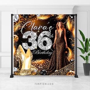 May include: A black backdrop with gold and silver accents featuring a woman in a leopard print dress. The number 36 is in large silver glitter with the word "Birthday" below it. The text "Clara's" is above the number 36.