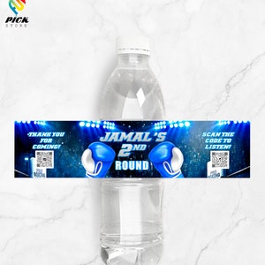 May include: Blue and black water bottle label with a boxing theme. The label says "Jamal's 2nd Round" with blue boxing gloves on either side of the text. The label also has a QR code and the text "Thank you for coming!" and "Scan the code to listen!"