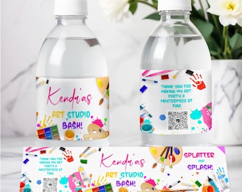 May include: Water bottle labels with a colorful art studio theme. The labels feature paintbrushes, paint tubes, paint palettes, and the text "Kendrias Art Studio Bash!" and "Splatter and Splash!"