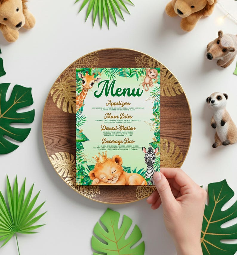 A hand is holding a menu with a jungle theme, surrounded by various stuffed animals and tropical leaves.