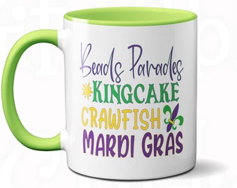 Grappige Mardi Gras-koffiemok: New Orleans-kralen, kingcake, langoesten