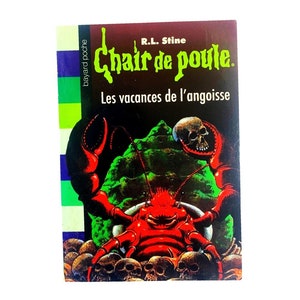 May include: A book cover featuring a red and green illustration of a crab with a skull on its head. The title of the book is "Chair de poule" and the subtitle is "Les vacances de l'angoisse".