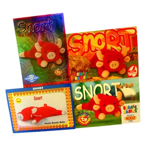 May include: Four trading cards featuring a red bull character named Snort. The cards are from the Beanie Babies collection. The cards feature different images of Snort, including a close-up of his face, a full-body shot, and a shot of him lying down. The cards also include the text "Snort the bull" and "Beanie Babies".